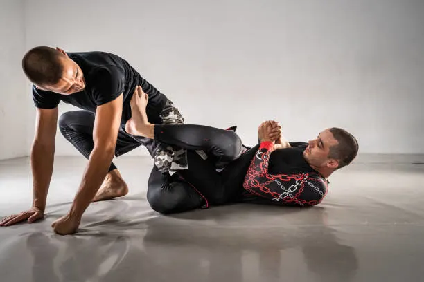 Two men sparring using BJJ spats